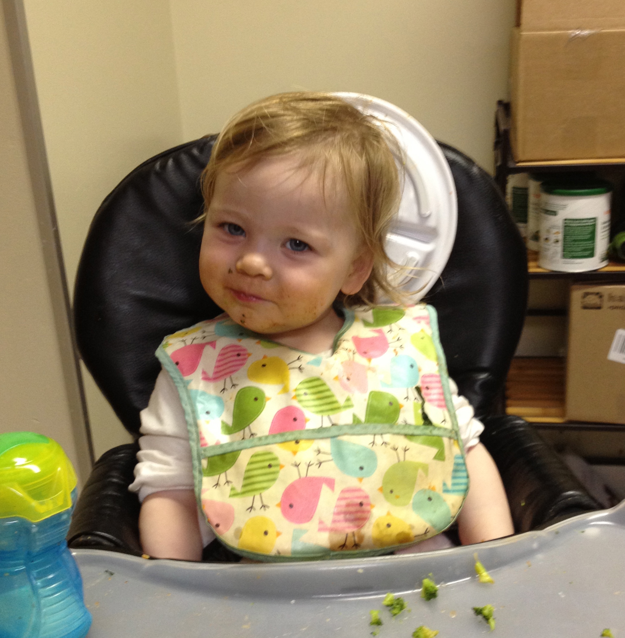 Plate behind the head.  Typical toddler behavior. And check out the naughty grin. 