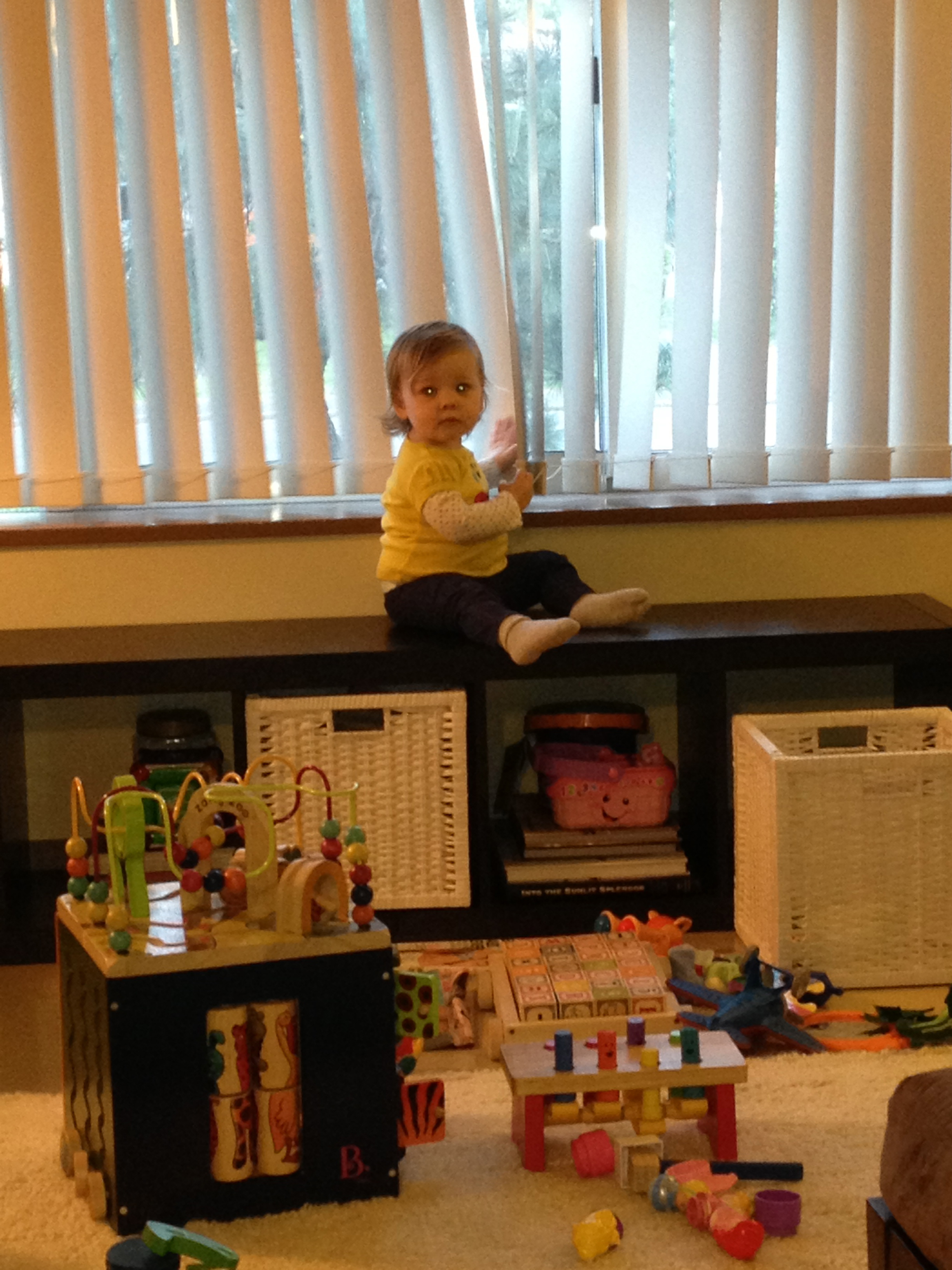 Climbing.  Maybe she's avoiding the mess she created. 