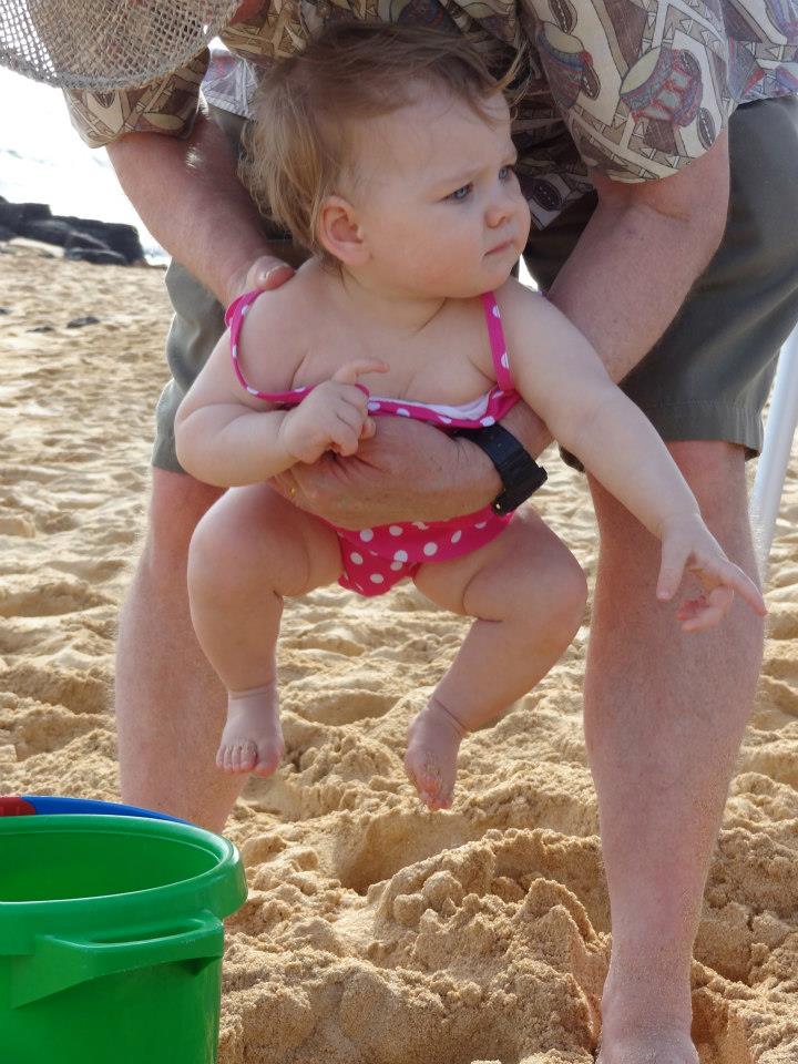 Refusing to let her feet so much as touch the sand.