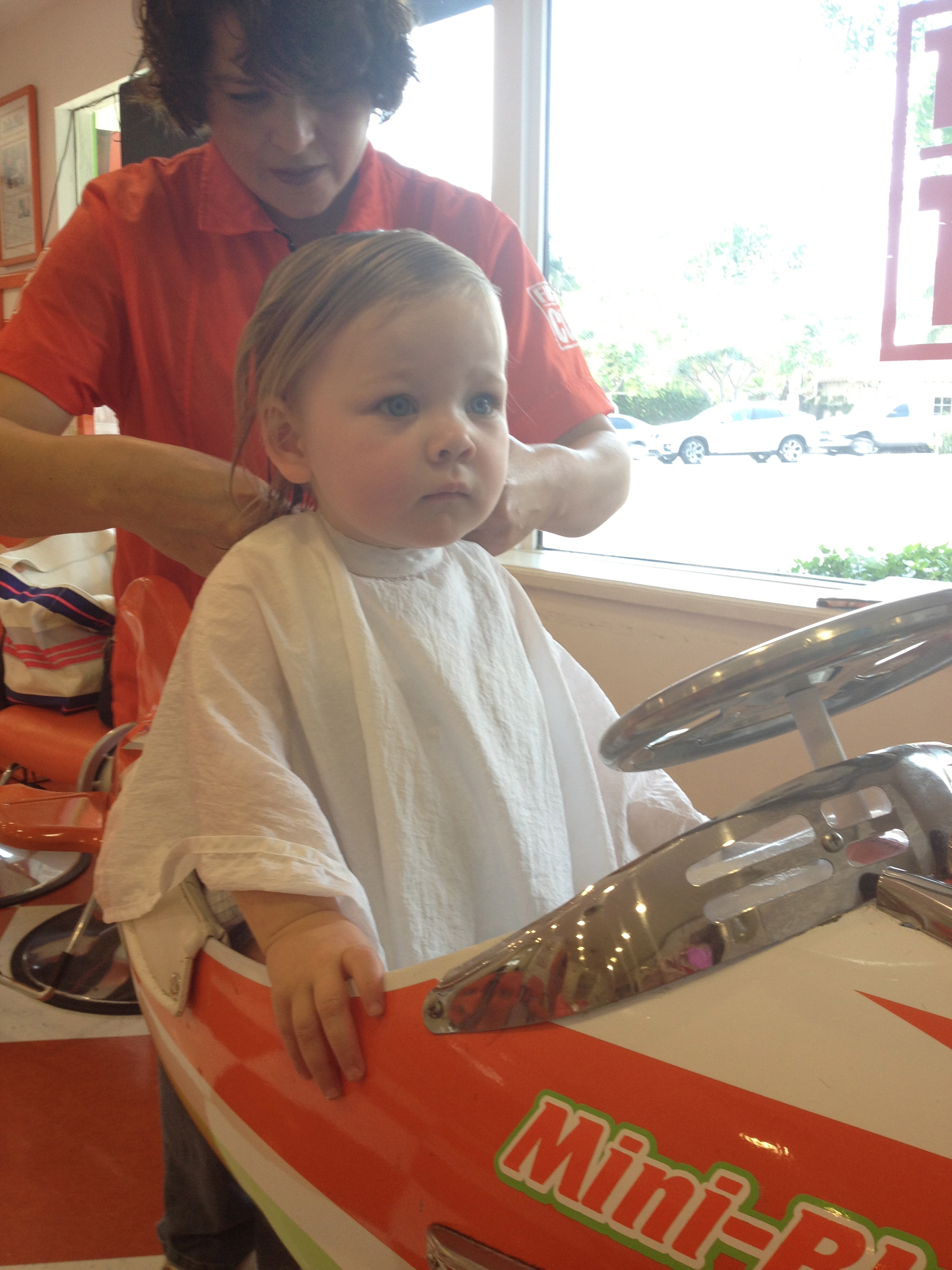 Holding on for dear life, all the while keeping her eyes glued to the television. 