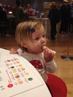 Elisabeth snacking on a cheese stick, once we learned we wouldn't be eating anything else at the museum