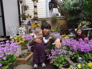 Sumiko playing with the kids in her garden.